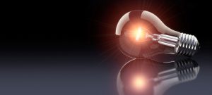 A picture of a lightbulb sitting on a flat surface. This is used on our "Ideas" page.